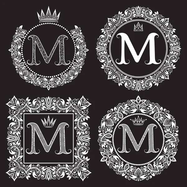 Vintage monograms set of M letter. Heraldic coats of arms in wreaths, round and square frames — Stock Vector