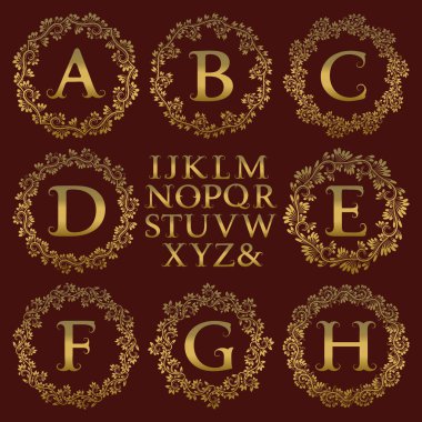Vintage monogram kiti. Altın harfler ve antik tarzda ilk logo oluşturmak için çiçek yuvarlak çerçeve.