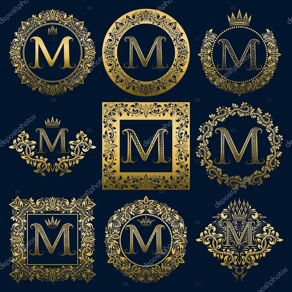 Vintage monograms set of M letter. Golden heraldic logos in wreaths, round and square frames.