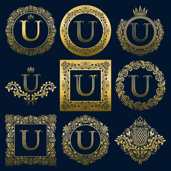 Vintage monograms set of U letter. Golden heraldic logos in wreaths, round and square frames. — Stock Vector