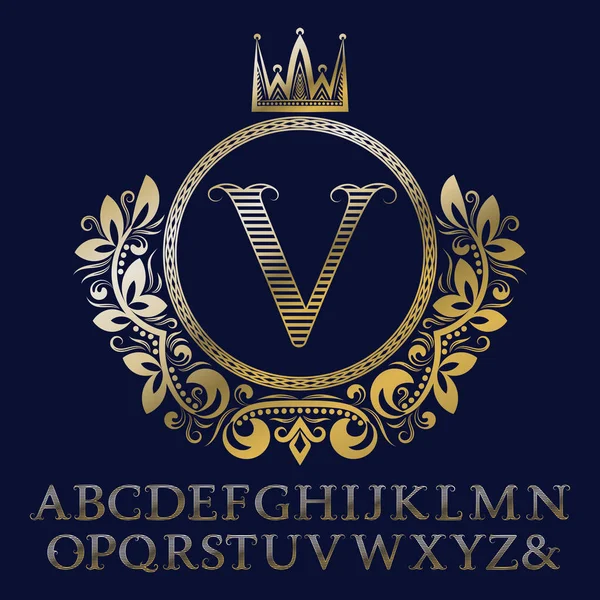 Striped gold letters and initial monogram in coat of arms form with crown. Royal font and elements kit for logo design. — Stock Vector