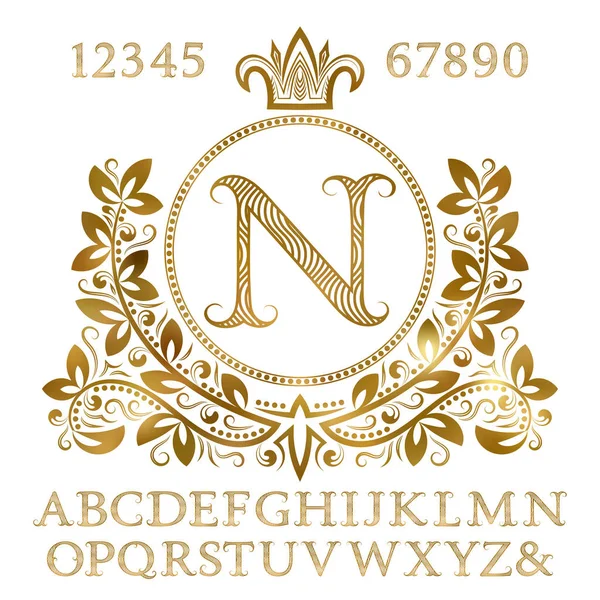 Złote wzory liter i cyfr z monogram początkowego w formie herbu. Błyszczący zestaw czcionek i elementów do projektu logo. — Wektor stockowy