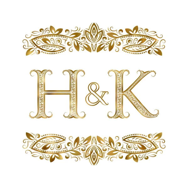 H e K iniciais vintage símbolo do logotipo. As letras são cercadas por elementos ornamentais . —  Vetores de Stock