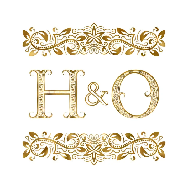 H and O vintage initials logo symbol. The letters are surrounded by ornamental elements. — Stock Vector