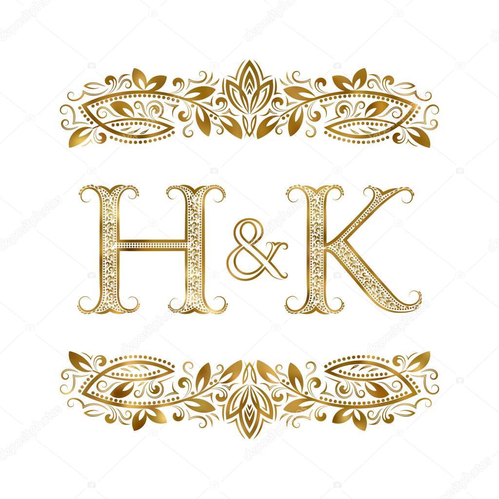 H and K vintage initials logo symbol. The letters are surrounded by ornamental elements.