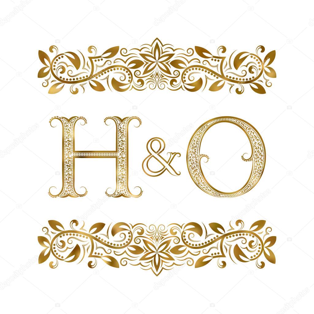 H and O vintage initials logo symbol. The letters are surrounded by ornamental elements. Wedding or business partners monogram in royal style.