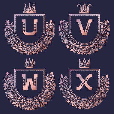 Altın Barok tarzında ayarla kat yükseldi. Altın pembe vintage logo U, V, W, X monogram.