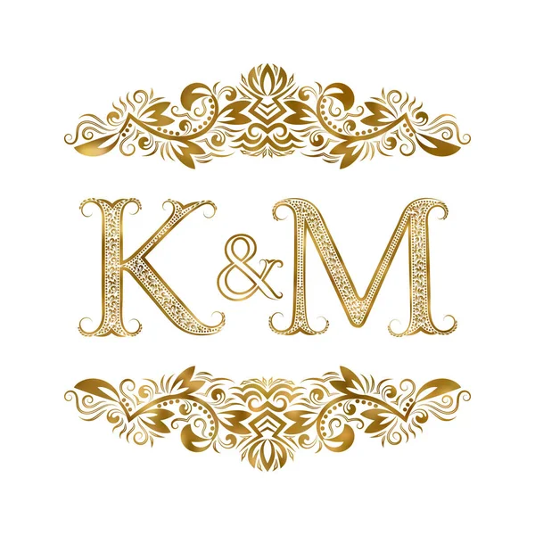 K and M vintage initials logo symbol. The letters are surrounded by ornamental elements. Wedding or business partners monogram in royal style. — Stock Vector