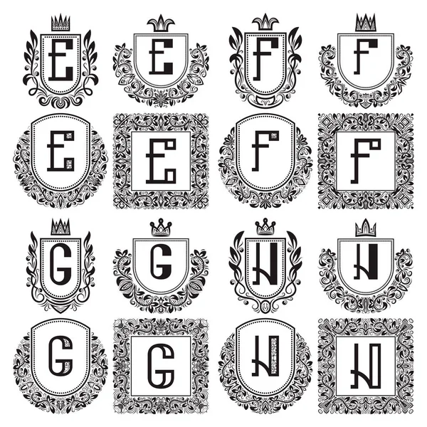 Conjunto de monogramas vintage aislados. Logotipos heráldicos con letra E, F, G, H. Abrigos negros en coronas, marcos redondos y cuadrados . — Vector de stock