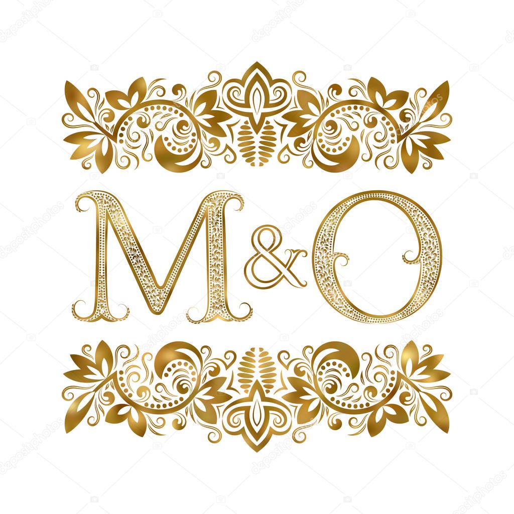 M and O vintage initials logo symbol. The letters are surrounded by ornamental elements. Wedding or business partners monogram in royal style.