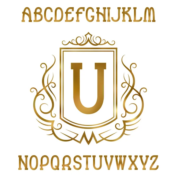 Letras doradas con monograma inicial en forma de escudo de armas. Brillante fuente serif y elementos de diseño del logotipo . — Vector de stock