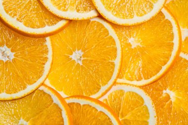 Portakal arka plan dilimlenmiş, parlak taze meyve bile dilimler halinde kesin
