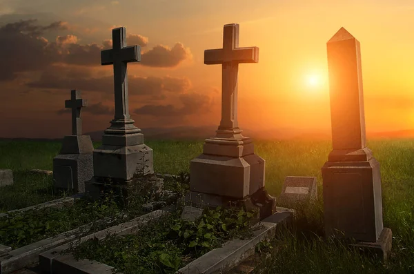 Creepy atmosphere in the cemetery with tombstone