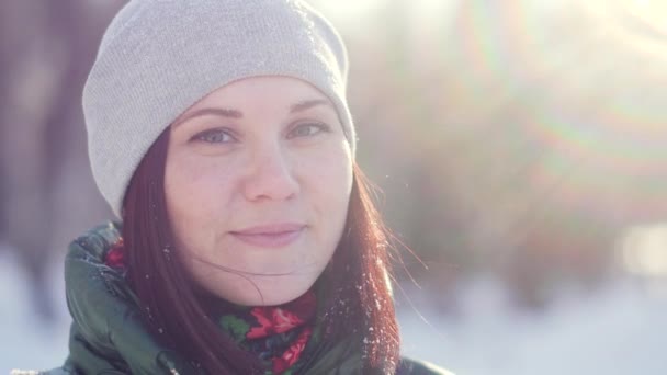 Winter portrait of a charming young woman looking at the camera — Stock Video