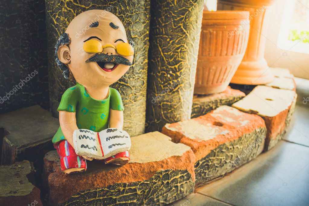 old man and woman ceramic dolls