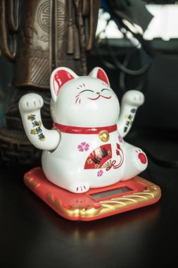 Maneki Neko Japanese lucky cat figure clipart