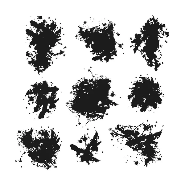 Set aus schwarzen Klecksen und Tintenspritzern — Stockvektor
