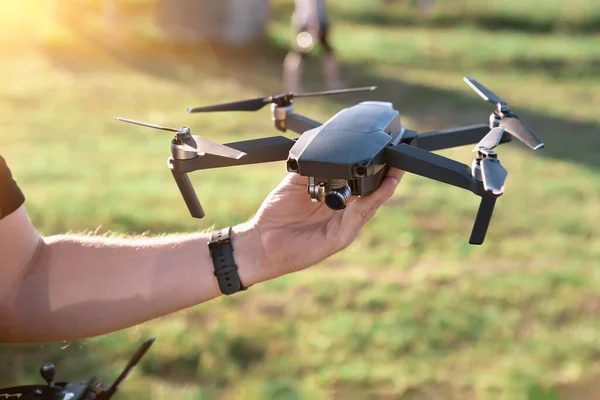 Remote controlled copter with digital camera in the hand. Closeup. — Stok fotoğraf
