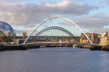 Gateshead Millennium and Tyne Bridge over the River Tyne, Newcastle, UK clipart