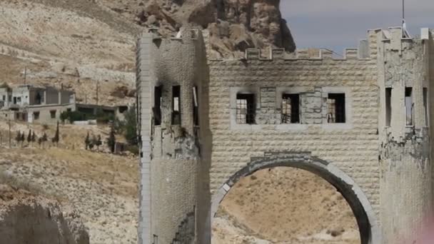 Maloula, Syria, September 18: Damaged gates before entering the Syrian city of Maalula after the fighting — Stock Video