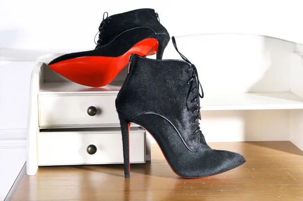 Women's Ankle boots handmade. Imitation brand shoes Christian Louboutin, showing red soles — Stock Photo, Image