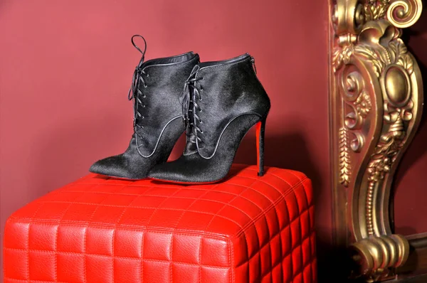 Women's ankle boots handmade. Imitation brand shoes Christian Louboutin, showing red soles — Stock Photo, Image