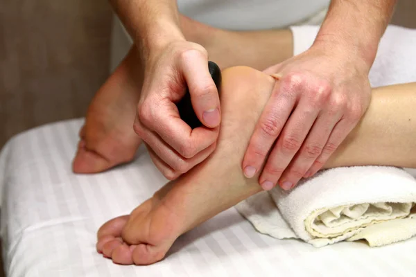 Woman Receiving Hot Stone Foot Massage — Stock Photo, Image
