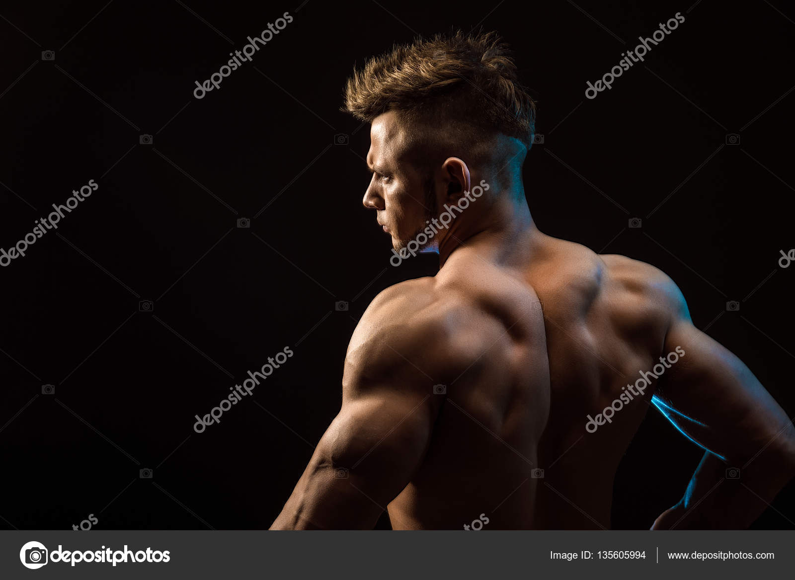 Handsome Young Muscle Man Showing Muscular Back And Arms In A Pose Isolated  On White Stock Photo, Picture and Royalty Free Image. Image 23236693.