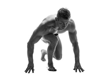 Adam çalıştırmak için hazırlanıyor. siluet. beyaz izole et. Siyah ve beyaz fotoğraf