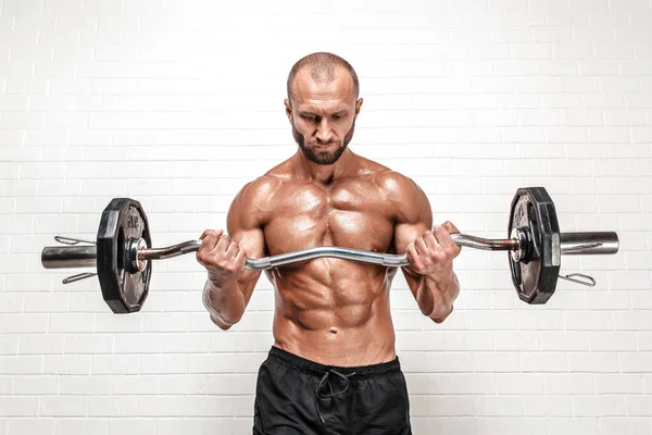 Strong man with weight bar — Stock Photo, Image