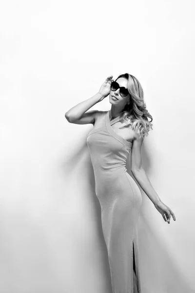 Beautiful blonde model in dress posing at camera — Stock Photo, Image