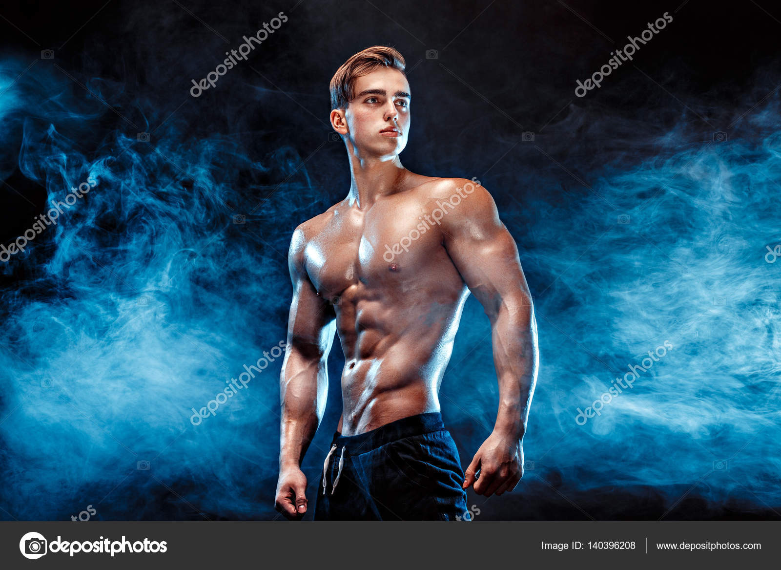 Strong bodybuilder with six pack, perfect abs, shoulders, biceps - Main Image