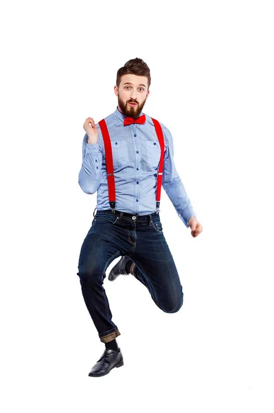 Stylish guy in the blue shirt with red bowtie and suspenders iso — Stock Photo, Image