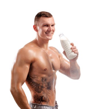 spor kişi, sağlıklı bir insan süt şişesi elinde. dövme