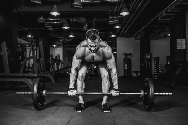 Young shirtless man doing deadlift exercise at gym. motivation. — Stock Photo, Image