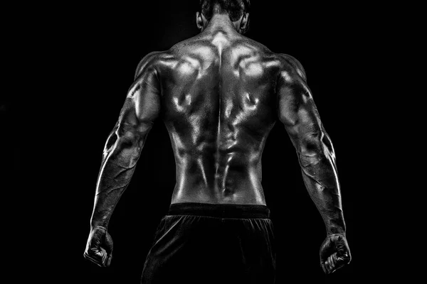 Back view of Unrecognizable man, strong muscles posing with arms down — Stock Photo, Image