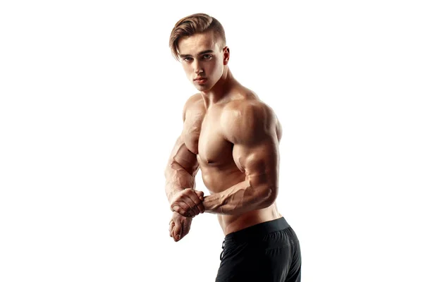 Musculoso super-alto nivel guapo hombre posando sobre fondo blanco — Foto de Stock