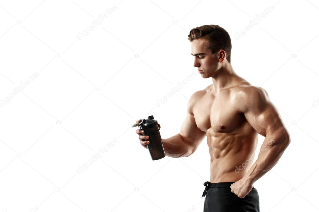 Muscular man with protein drink in shaker over white background