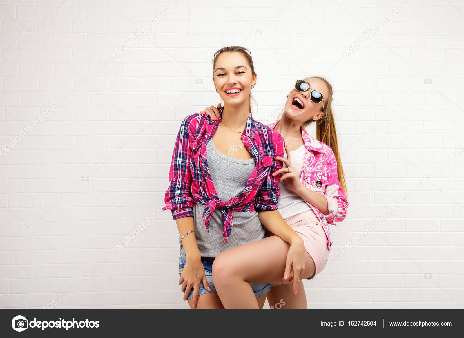 Fashion portrait of two friends posing. modern lifestyle. two ...
