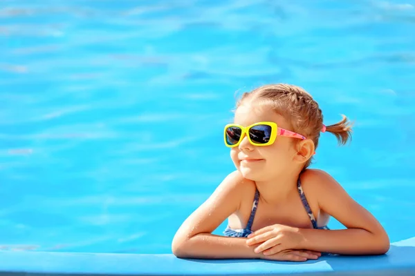 Cute girl in pool Royalty Free Stock Images