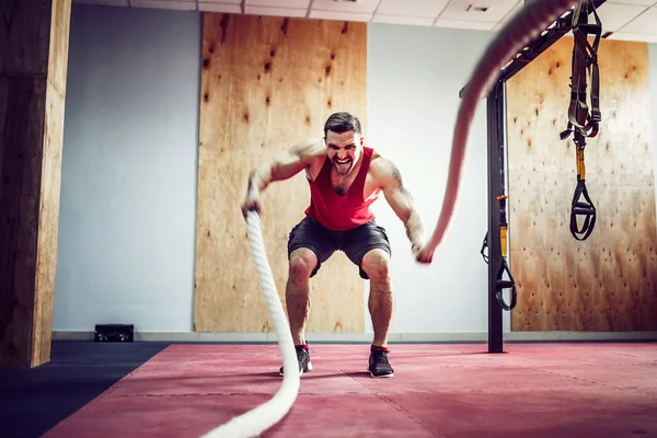 Men with battle rope in functional training fitness — Stock Photo, Image