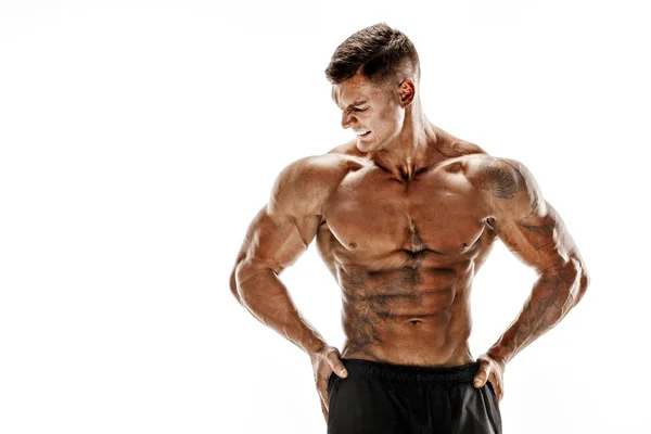 Muskulöse super-high-level gutaussehender Mann posiert auf weißem Hintergrund — Stockfoto