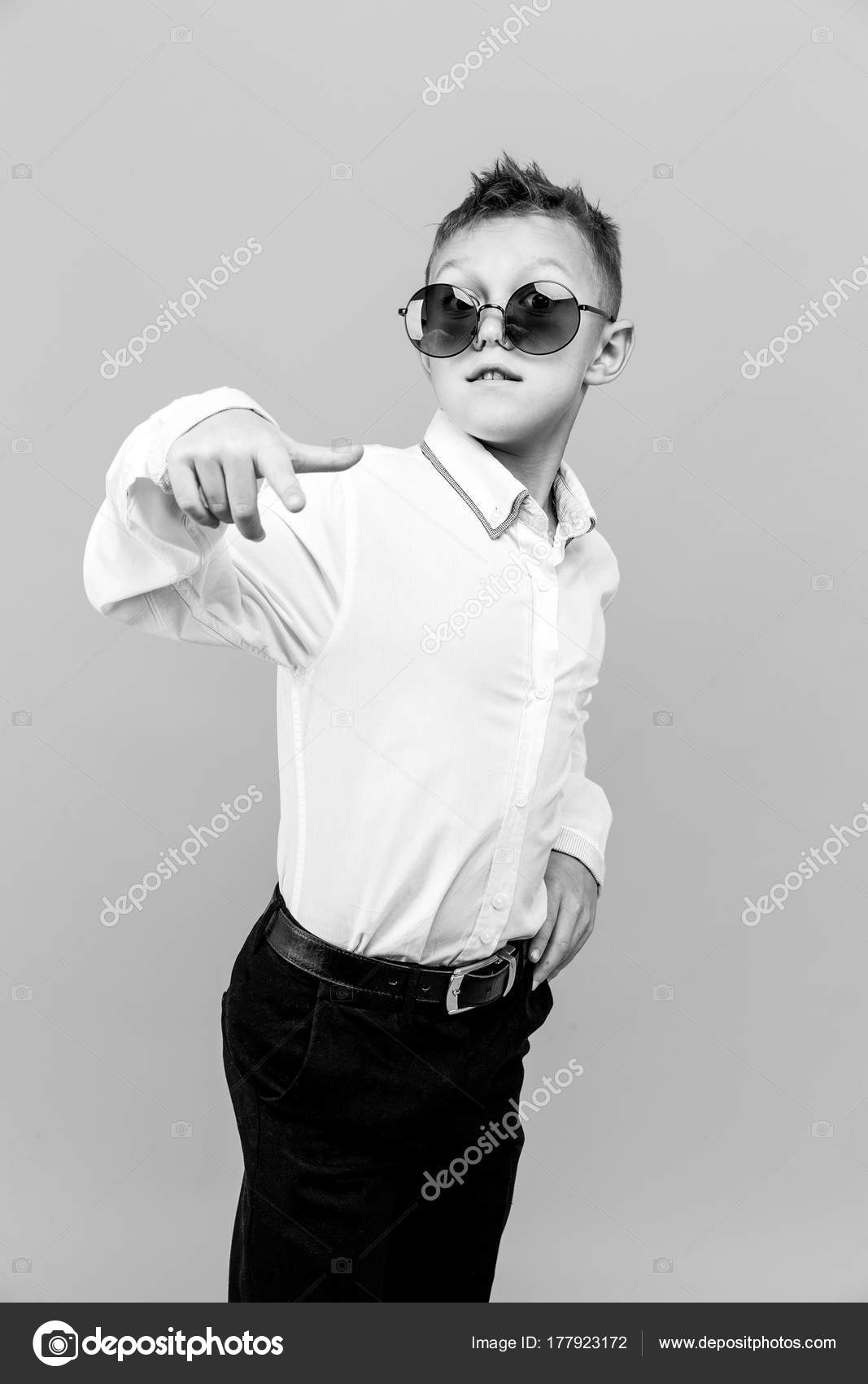 Premium Vector  Young boy wearing sunglasses and t shirt with splash of  paint behind him