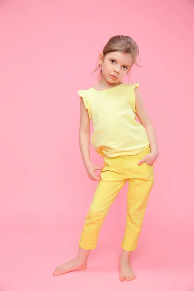 Young little girl posing in studio — Stock Photo, Image