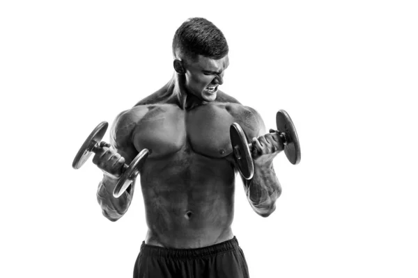 Strong topless man doing exercise with dumbbells — Stock Photo, Image