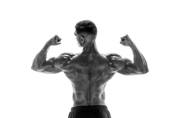 Bodybuilder showing his back and biceps muscles isolated on a wh — Stock Photo, Image