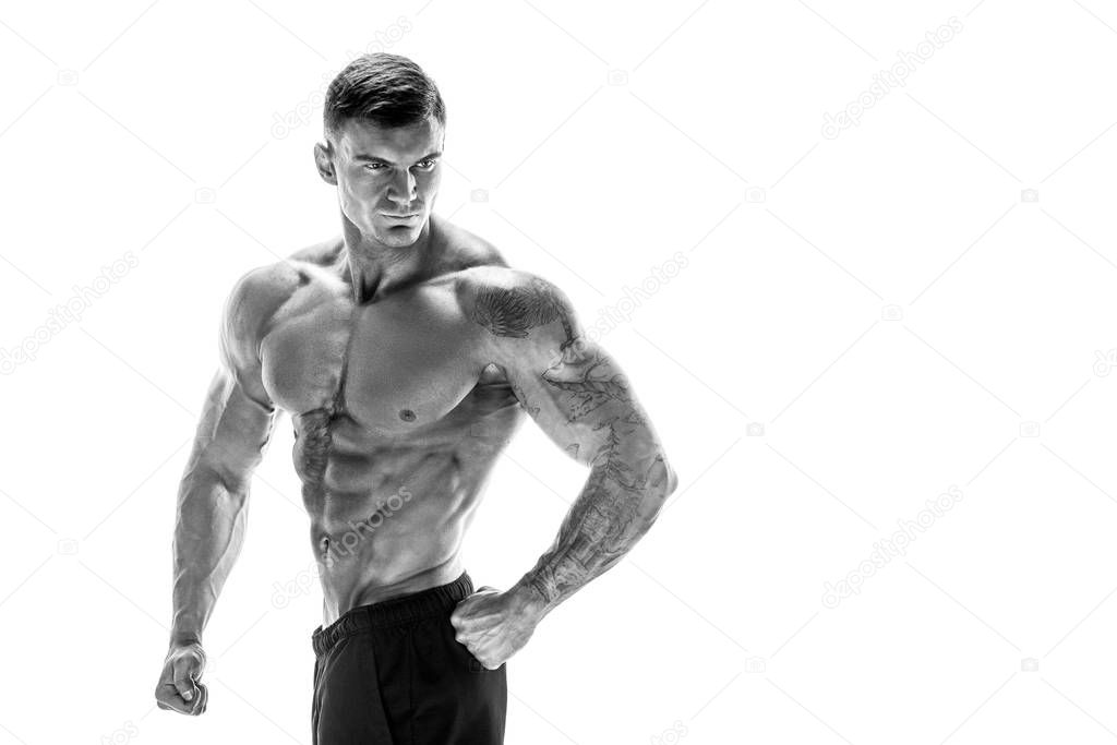 muscular super-high level handsome man posing on white backgroun