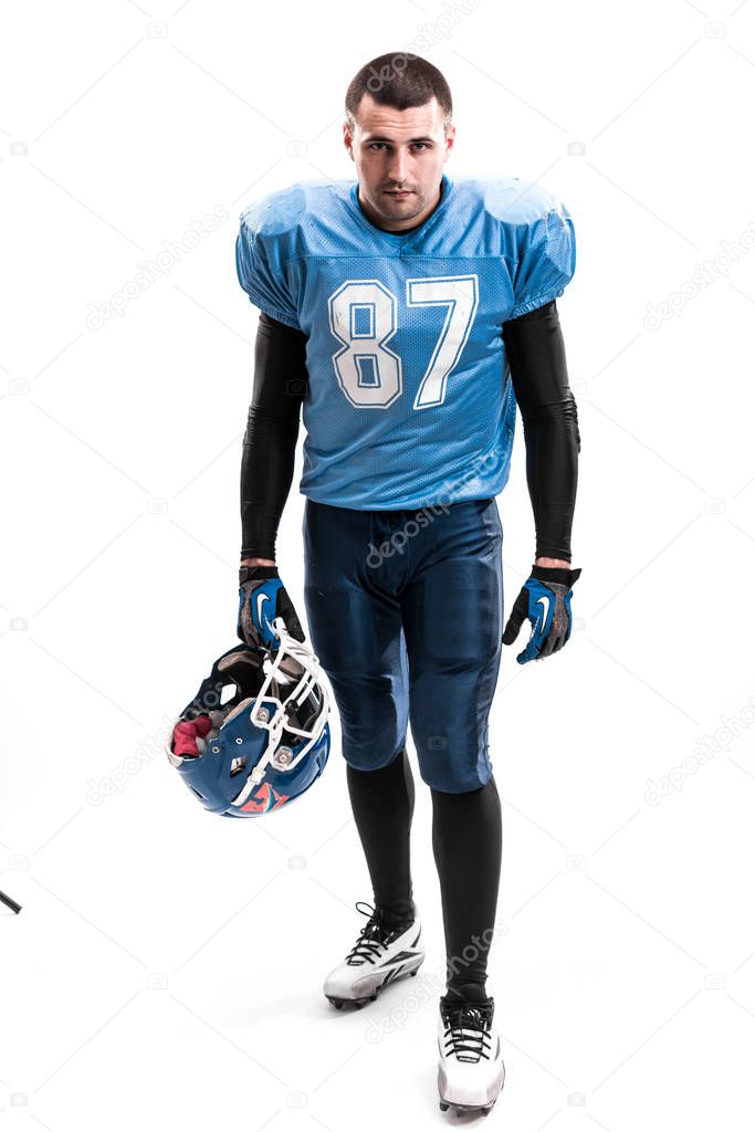 American Football Player with blue uniform on the scrimmage line. White background