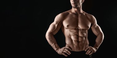 Unrecognizable Strong Athletic Sexy Muscular Man on Black Background clipart
