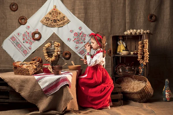 Adorable girl drinking tea from samovar — Stock Photo, Image